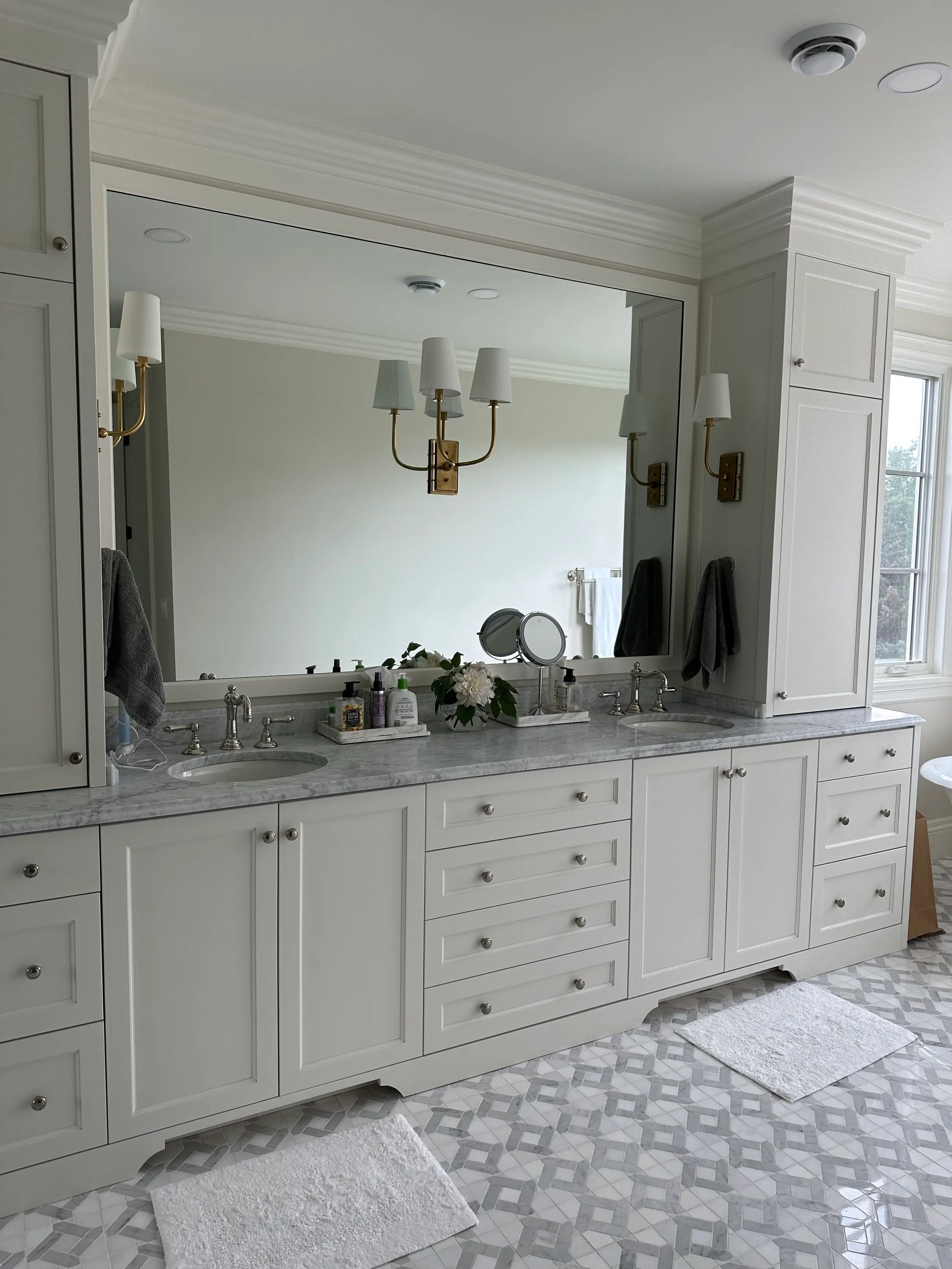 Updated tile, a modern vanity, and refreshed fixtures showcase this complete bathroom design transformation.